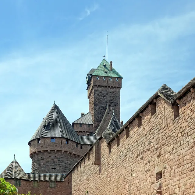 The pink-sandstone keep and curtain wall of Haut-Kœnigsbourg against the sky